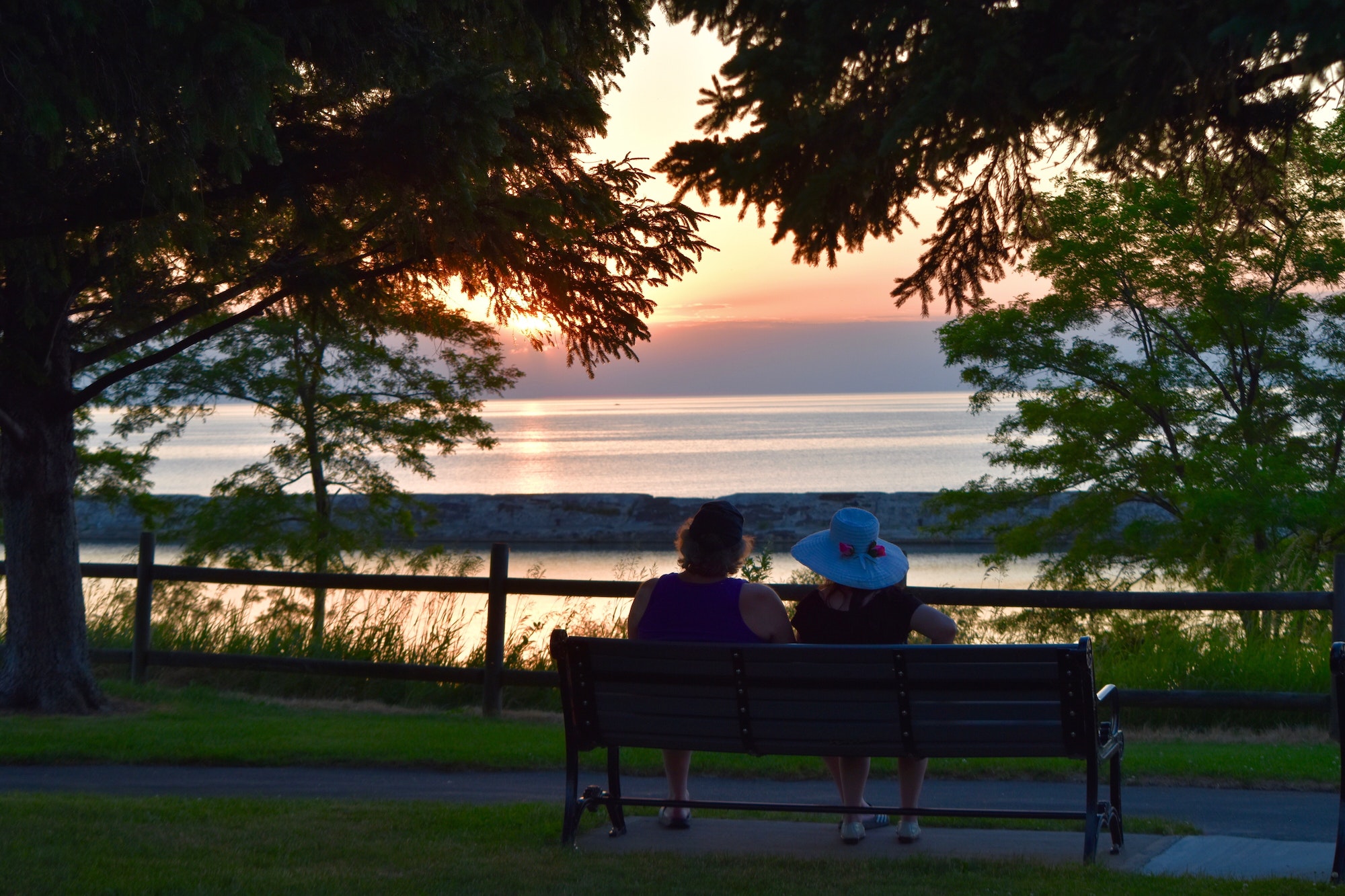 Couple enjoying the sunset on Lake Ontario
